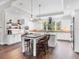 Spacious kitchen with island, stainless steel appliances, and hardwood floors at 19458 Beacon Park Pl, Lakewood Ranch, FL 34202