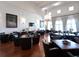 Spacious living room with hardwood floors and leather seating at 19458 Beacon Park Pl, Lakewood Ranch, FL 34202