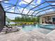 Luxury pool and spa with lake view and screened enclosure at 19458 Beacon Park Pl, Lakewood Ranch, FL 34202