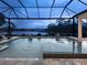 Relaxing pool and spa with a screened enclosure at 19458 Beacon Park Pl, Lakewood Ranch, FL 34202