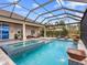 Stunning pool and spa with covered lanai and lake view at 19458 Beacon Park Pl, Lakewood Ranch, FL 34202