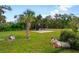Spacious backyard with a cleared area and basketball hoop at 20255 Macon Ln, Port Charlotte, FL 33952