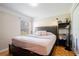 Spacious bedroom with king-size bed and hardwood floors at 20255 Macon Ln, Port Charlotte, FL 33952