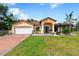 Charming single-story home with a landscaped yard and attached garage at 20255 Macon Ln, Port Charlotte, FL 33952