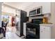 Stainless steel appliances and white cabinetry in kitchen at 20255 Macon Ln, Port Charlotte, FL 33952
