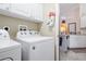 Laundry room with side-by-side washer and dryer at 20255 Macon Ln, Port Charlotte, FL 33952