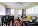 Sunroom with seating area, dining table, and large windows at 20255 Macon Ln, Port Charlotte, FL 33952