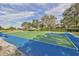 Community basketball court on a bright day, offering space for outdoor recreation and sports at 219 Heritage Isles Way, Bradenton, FL 34212