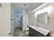 A modern bathroom featuring a vessel sink, marble countertop, and stylish fixtures at 219 Heritage Isles Way, Bradenton, FL 34212