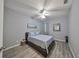 A bright bedroom with a full bed, neutral walls, wood-style flooring, and ample natural light at 219 Heritage Isles Way, Bradenton, FL 34212
