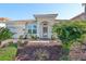 Charming single story home with a lush landscaped yard and a tile roof at 219 Heritage Isles Way, Bradenton, FL 34212