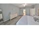 Spacious main bedroom features a large bed, dresser, and doorway leading to another room at 219 Heritage Isles Way, Bradenton, FL 34212