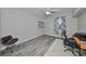 Light-filled office with modern floors, a ceiling fan, and a sleek furniture arrangement at 219 Heritage Isles Way, Bradenton, FL 34212