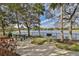 Community picnic area with a charcoal grill and lake views for outdoor gatherings at 219 Heritage Isles Way, Bradenton, FL 34212