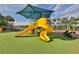 Bright and colorful community playground with a slide, climbing area, and shade structure at 219 Heritage Isles Way, Bradenton, FL 34212