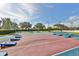 Community shuffleboard and cornhole courts with covered picnic tables for residents' enjoyment at 219 Heritage Isles Way, Bradenton, FL 34212