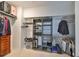 A fully organized walk-in closet with shelves, hanging rods, and a separate storage area at 219 Heritage Isles Way, Bradenton, FL 34212