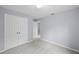 Bright bedroom with double doors leading to closet and carpeted floors at 22402 Peachland Blvd, Port Charlotte, FL 33954