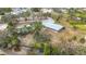 Aerial view of community with pool, building, and waterway at 2523 Darwin Ave, Sarasota, FL 34239