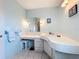 Bathroom features a vanity with sink and a large mirror at 2523 Darwin Ave, Sarasota, FL 34239