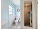 Clean bathroom with toilet and shower stall at 2523 Darwin Ave, Sarasota, FL 34239
