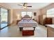 Bedroom with queen bed, wood furniture, and access to patio at 2523 Darwin Ave, Sarasota, FL 34239