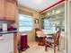 Small breakfast nook with built-in shelving and a round table at 2523 Darwin Ave, Sarasota, FL 34239