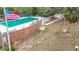 Community pool with brick wall and surrounding grassy area at 2523 Darwin Ave, Sarasota, FL 34239