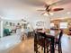 Bright dining area with wood table and chairs, open to living room at 2523 Darwin Ave, Sarasota, FL 34239