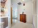 Entryway with wood cabinet and access to other rooms at 2523 Darwin Ave, Sarasota, FL 34239