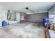 Attached garage with shelving and storage space at 2523 Darwin Ave, Sarasota, FL 34239
