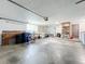 Spacious garage with ample storage shelving and workbench at 2523 Darwin Ave, Sarasota, FL 34239