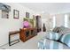 Living room with stylish sofa and wooden cabinet at 2523 Darwin Ave, Sarasota, FL 34239