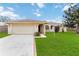 Single-story home with attached garage and well-maintained lawn at 3121 Mohawk St, Sarasota, FL 34231