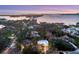 Aerial view of waterfront homes at sunset at 3414 Old Oak Dr, Sarasota, FL 34239