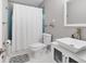 Clean bathroom with white vanity, modern sink, and blue tile accents at 3414 Old Oak Dr, Sarasota, FL 34239