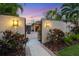 Entryway with lights, fountain, and paved courtyard at 3414 Old Oak Dr, Sarasota, FL 34239