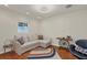 Light and airy Gathering room featuring a comfortable sectional sofa and terracotta tile floors at 3414 Old Oak Dr, Sarasota, FL 34239