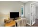 Bright home office with a large window, providing ample natural light at 3414 Old Oak Dr, Sarasota, FL 34239