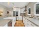 Modern kitchen with white cabinets and concrete countertops at 3414 Old Oak Dr, Sarasota, FL 34239