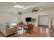 Open living area with vaulted ceiling, skylights and tiled floors at 3414 Old Oak Dr, Sarasota, FL 34239