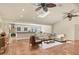Spacious living room with terracotta tile floor and open floor plan at 3414 Old Oak Dr, Sarasota, FL 34239