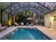 This screened pool and patio offers plenty of space to relax at 3414 Old Oak Dr, Sarasota, FL 34239