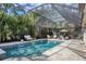 This stunning screened pool and patio is perfect for relaxation at 3414 Old Oak Dr, Sarasota, FL 34239