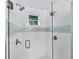 Large walk-in shower with glass enclosure, dual shower heads, and modern tile at 3414 Old Oak Dr, Sarasota, FL 34239