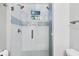 Large walk-in shower with glass enclosure, dual shower heads, and modern tile at 3414 Old Oak Dr, Sarasota, FL 34239