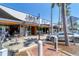 Outdoor seating at Libby's Neighborhood Brasserie on a sunny day at 3414 Old Oak Dr, Sarasota, FL 34239