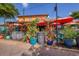 Outdoor seating at a tropical-themed bar with vibrant umbrellas at 3414 Old Oak Dr, Sarasota, FL 34239