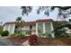 Two-story condo building with red tile roofs and lush landscaping at 3606 Beneva Rd # 502, Sarasota, FL 34232
