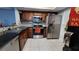 Updated kitchen with stainless steel appliances and dark wood cabinets at 3606 Beneva Rd # 502, Sarasota, FL 34232